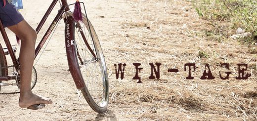 Foto bambino in bici con scritta "Win-tage"